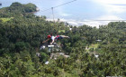 Zipping the 1.3 kilometer zipline at Dakak Beach Resort Adventures